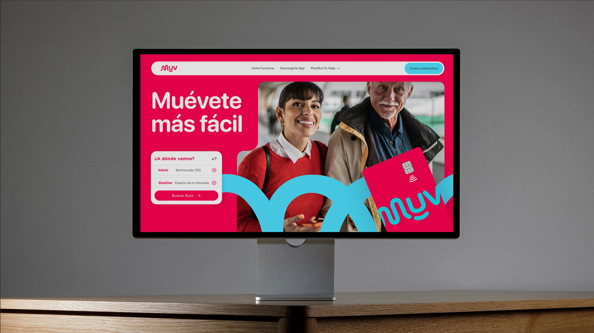 Computer screen showing MetroMuv website with smiling woman and man, route search, and MetroMuv card image.